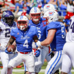 
              SMU running back Tre Siggers (4) reacts after scoring a touchdown against TCU during the first half of an NCAA college game on Saturday, Sept. 24, 2022, in Dallas, Texas. (AP Photo/Gareth Patterson)
            