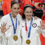 
              FILE - United States' Diana Taurasi, left, and Sue Bird pose with their gold medals during the medal ceremony for women's basketball at the 2020 Summer Olympics, Aug. 8, 2021, in Saitama, Japan. The Storm's loss to the Las Vegas Aces on Tuesday night ended a ride she has shared with Taurasi, also a Connecticut alum. “Looking back on it, it’s been incredible to be in a job with your best friend for 20 years,” Taurasi said. “You don’t get to do that, most people don’t get to do that in any job, let alone basketball. So, it’s been an incredible journey.” (AP Photo/Charlie Neibergall, File)
            
