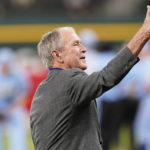
              Former President George W. Bush gives a thumbs-up after the first pitch to recognize the 21st anniversary of Patriot Day before a baseball game between the Toronto Blue Jays and the Texas Rangers in Arlington, Texas, Sunday, Sept. 11, 2022. (AP Photo/LM Otero)
            