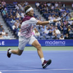 
              Casper Ruud, of Norway, returns a shot to Matteo Berrettini, of Italy, during the quarterfinals of the U.S. Open tennis championships, Tuesday, Sept. 6, 2022, in New York. (AP Photo/Seth Wenig)
            