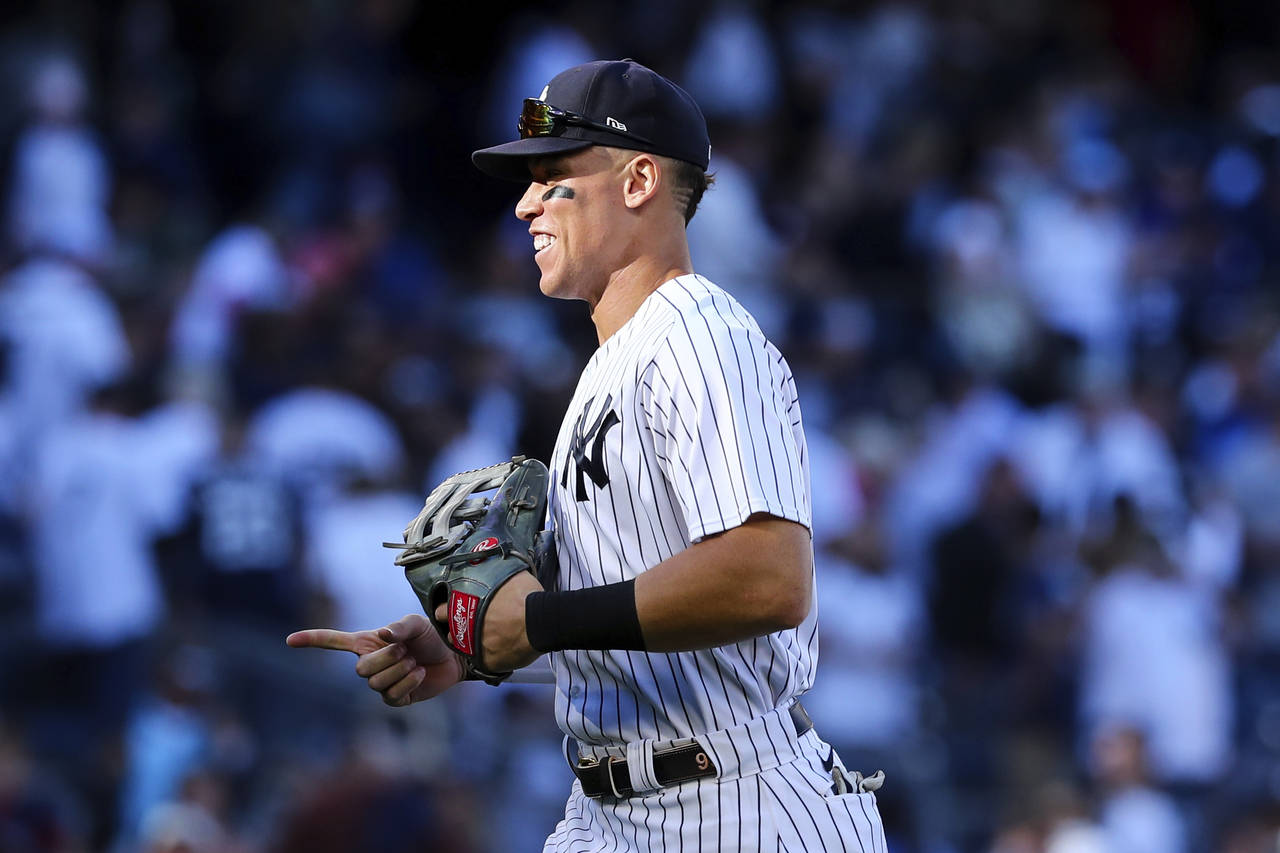 New York Yankees right fielder Aaron Judge gestures to his teammates after the defeated the Boston ...