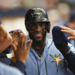 
              Tampa Bay Rays' Yandy Diaz reacts in the dugout after scoring against the Texas Rangers during the third inning of a baseball game Sunday, Sept. 18, 2022, in St. Petersburg, Fla. (AP Photo/Mark LoMoglio)
            