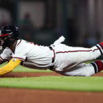 
              Atlanta Braves' Ronald Acuna Jr. slides into second base on an unsuccessful steal-attempt in the third inning of a baseball game against the Washington Nationals, Monday, Sept. 19, 2022, in Atlanta. (AP Photo/John Bazemore)
            