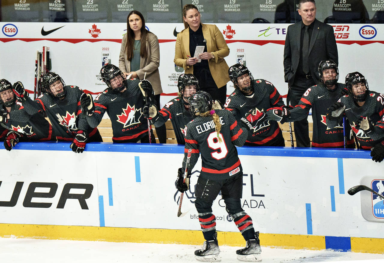Canada's Kristin O'Neill celebrates after scoring during the IIHF World Championship women's hockey...