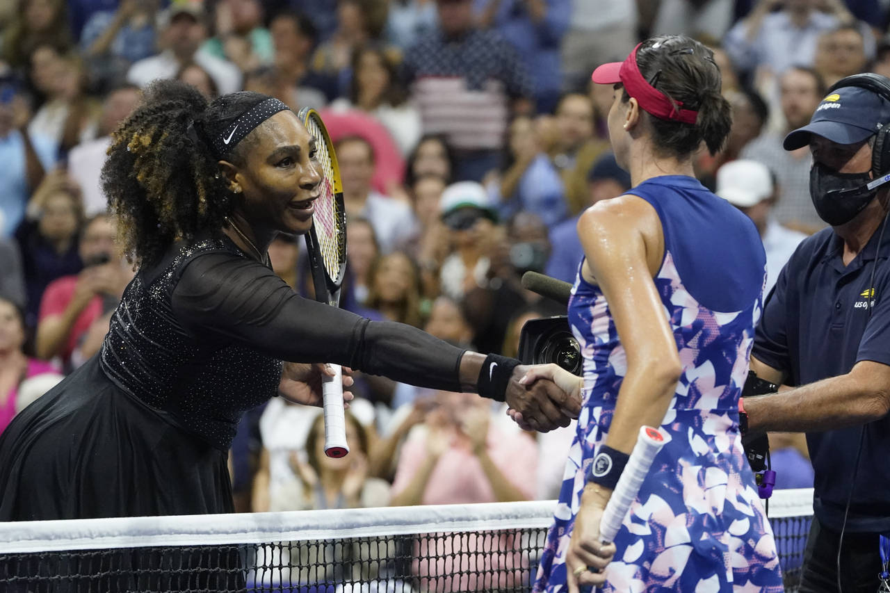 Serena Williams, left, of the United States, shakes hands with Ajla Tomljanovic, of Austrailia, aft...