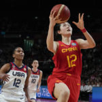 
              China's Pan Zhenqi lays up to score a goal during their game at the women's Basketball World Cup against the United States in Sydney, Australia, Saturday, Sept. 24, 2022. (AP Photo/Mark Baker)
            