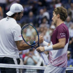 
              Casper Ruud, of Norway, right, shakes hands with Matteo Berrettini, of Italy, after winning their quarterfinal match of the U.S. Open tennis championships, Tuesday, Sept. 6, 2022, in New York. (AP Photo/Seth Wenig)
            