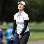 
              Xiyu Lin, of China, reacts after missing a putt on the 17th green during the final round of the LPGA Tour Kroger Queen City Championship golf tournament in Cincinnati, Sunday, Sept. 11, 2022. (AP Photo/Paul Vernon)
            