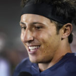 
              Illinois quarterback Tommy DeVito smiles as he gives a television interview after the team's 31-0 win over Chattanooga in an NCAA college football game Thursday, Sept. 22, 2022, in Champaign, Ill. (AP Photo/Charles Rex Arbogast)
            
