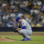 
              Los Angeles Dodgers relief pitcher Craig Kimbrel takes a moment before facing a San Diego Padres batter during the 10th inning of a baseball game Tuesday, Sept. 27, 2022, in San Diego. (AP Photo/Gregory Bull)
            