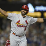 
              St. Louis Cardinals designated hitter Albert Pujols (5) reacts after hitting a home run during the fourth inning of a baseball game against the Los Angeles Dodgers in Los Angeles, Friday, Sept. 23, 2022. Brendan Donovan and Tommy Edman also scored. It was Pujols' 700th career home run. (AP Photo/Ashley Landis)
            