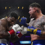 
              Andy Ruiz, Jr., right, fights Luis Ortiz in a WBC world heavyweight title eliminator boxing match, Sunday, Sept. 4, 2022, in Los Angeles. (AP Photo/Ashley Landis)
            