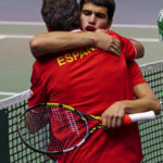 
              Spain's Carlos Alcaraz is congratulated by Spanish team coach Sergi Bruguera at the end of his match against Korea's Soonwoo Kwon, during the group B Davis Cup qualifier between Spain and Korea in Valencia, eastern Spain, Sunday, Sept. 18, 2022. (AP Photo/Alberto Saiz)
            
