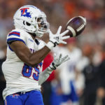 
              Louisiana Tech wide receiver Cyrus Allen makes a reception during the first half of the team's NCAA college football game against Clemson on Saturday, Sept. 17, 2022, in Clemson, S.C. (AP Photo/Jacob Kupferman)
            