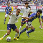 
              United States Sergino Dest, left, and Japan's Daichi Kamada fight for the ball during the international friendly soccer match between USA and Japan as part of the Kirin Challenge Cup in Duesseldorf, Germany, Friday, Sept. 23, 2022. (AP Photo/Martin Meissner)
            