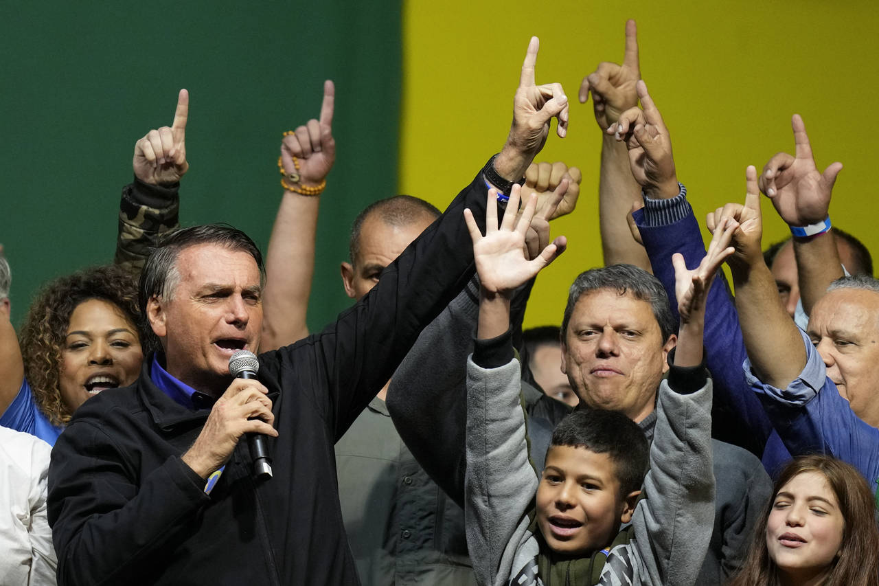 Brazilian President Jair Bolsonaro, who is running for a second term, speaks during a campaign rall...