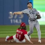 
              Tampa Bay Rays shortstop Taylor Walls turns a double play on Toronto Blue Jays shortstop Bo Bichette (11) hit into by Jays Teoscar Hernandez during fourth inning  of a baseball game in Toronto, Monday, Sept. 12, 2022. (Frank Gunn/The Canadian Press via AP)
            