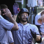 
              Colorado Rockies' Connor Joe (9) celebrates in the dugout after hitting a home run against the Chicago Cubs during the second inning of a baseball game, in Chicago, Sunday, Sept. 18, 2022. (AP Photo/Matt Marton)
            