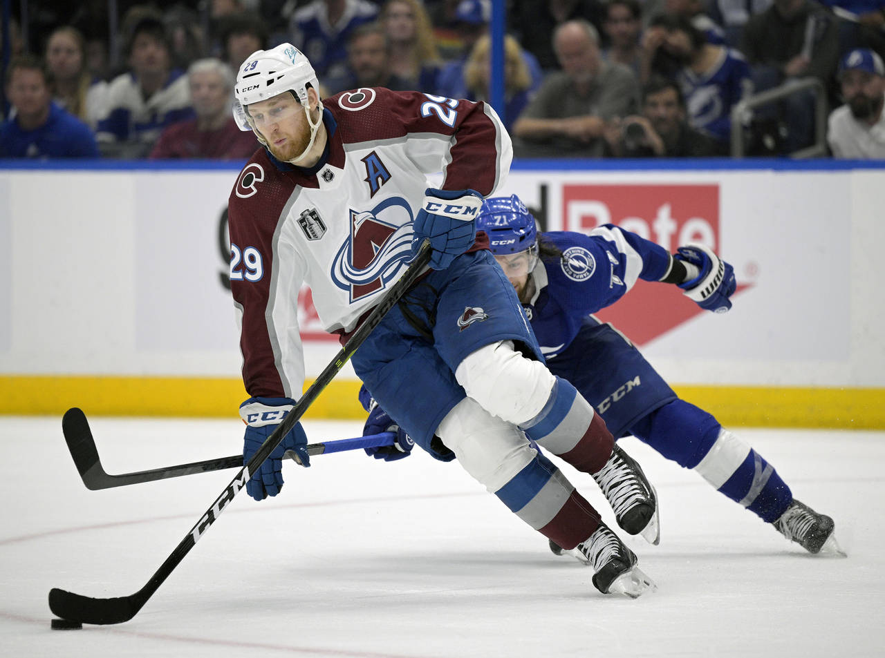 FILE - Colorado Avalanche center Nathan MacKinnon (29) controls a puck in front of Tampa Bay Lightn...