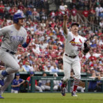 
              Chicago Cubs' Zach McKinstry, left, grounds out to St. Louis Cardinals starting pitcher Miles Mikolas, right, during the third inning of a baseball game Sunday, Sept. 4, 2022, in St. Louis. (AP Photo/Jeff Roberson)
            