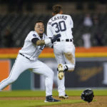 
              Detroit Tigers' Harold Castro (30) celebrates with Javier Baez after hitting the game winning single against the Kansas City Royals in the 10th inning of a baseball game in Detroit, Tuesday, Sept. 27, 2022. (AP Photo/Paul Sancya)
            