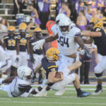 
              Stephen F. Austin safety JaTerious Evans brings down the Warner quarterback for a sack during an NCAA college football game Saturday, Sept. 24, 2022 in Nacogdoches, Texas. (Nathan Hague/The Daily Sentinel via AP)
            