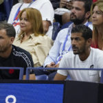 
              Karim Kamoun, left, Ons Jabeur's husband, and Issam Jellali, Jabeur's coach, watch play between Jabeur and Caroline Garcia, of France, during the semifinals of the U.S. Open tennis championships, Thursday, Sept. 8, 2022, in New York. (AP Photo/John Minchillo)
            