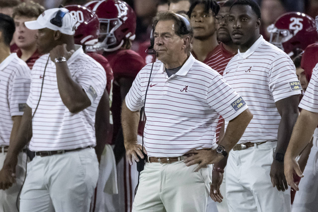 Alabama coach Nick Saban watches during the first half of the team's NCAA college football game aga...