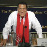 
              FILE - Japanese pro-wrestler-turned-politician Kanji "Antonio" Inoki bows at the end of a news conference at the Foreign Correspondents' Club of Japan in Tokyo on Aug. 21, 2014. A popular Japanese professional wrestler and lawmaker Antonio Inoki, who faced a world boxing champion Muhammad Ali in a mixed martial arts match in 1979, has died at 79. The New Japan Pro-Wrestling Co. says Inoki, who was battling an illness, died earlier Saturday, Oct. 1, 2022. (AP Photo/Eugene Hoshiko, File)
            