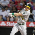 
              Oakland Athletics' Conner Capel singles to left field to score Tony Kemp during the first inning of a baseball game against the Los Angeles Angels in Anaheim, Calif., Wednesday, Sept. 28, 2022. (AP Photo/Alex Gallardo)
            