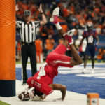 
              Houston wide receiver Nathaniel Dell (1) is upended after making a touchdown catch against UTSA during the second half of an NCAA college football game, Saturday, Sept. 3, 2022, in San Antonio. (AP Photo/Eric Gay)
            