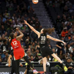 
              Las Vegas Aces guard Chelsea Gray (12) shoots over Seattle Storm forward Breanna Stewart (30) during the first half of Game 4 of a WNBA basketball playoff semifinal Tuesday, Sept. 6, 2022, in Seattle. (AP Photo/Lindsey Wasson)
            