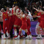 
              China celebrate after defeating Australia in their semifinal at the women's Basketball World Cup in Sydney, Australia, Friday, Sept. 30, 2022. (AP Photo/Mark Baker)
            