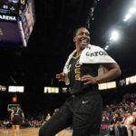 
              Las Vegas Aces guard Chelsea Gray (12) celebrates as her team leads the Connecticut Sun during the second half in Game 2 of a WNBA basketball final playoff series Tuesday, Sept. 13, 2022, in Las Vegas. (AP Photo/John Locher)
            