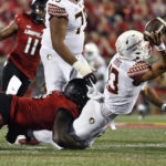 
              Louisville defensive lineman YaYa Diaby brings down Florida State quarterback Jordan Travis (13) during the first half of an NCAA college football game in Louisville, Ky., Friday, Sept. 16, 2022. (AP Photo/Timothy D. Easley)
            