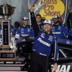 
              Chris Buescher celebrates with his trophy and sword after winning a NASCAR Cup Series auto race at Bristol Motor Speedway Saturday, Sept. 17, 2022, in Bristol, Tenn. (AP Photo/Mark Humphrey)
            