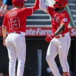 
              Los Angeles Angels' Livan Soto, left, congratulates Luis Rengifo for hitting a two-run home run, his second home run of the game, against the Seattle Mariners during the third inning of a baseball game in Anaheim, Calif., Sunday, Sept. 18, 2022. (AP Photo/Alex Gallardo)
            