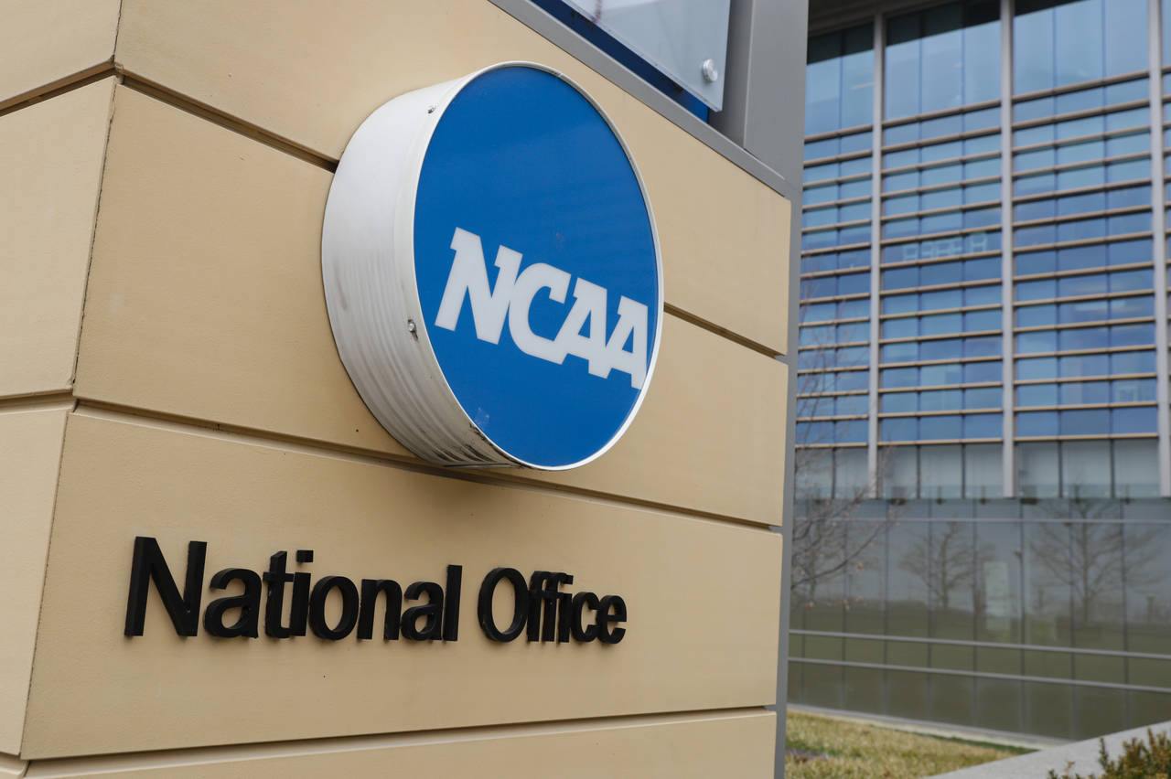 FILE - Signage at the headquarters of the NCAA is viewed in Indianapolis, March 12, 2020. The NCAA ...