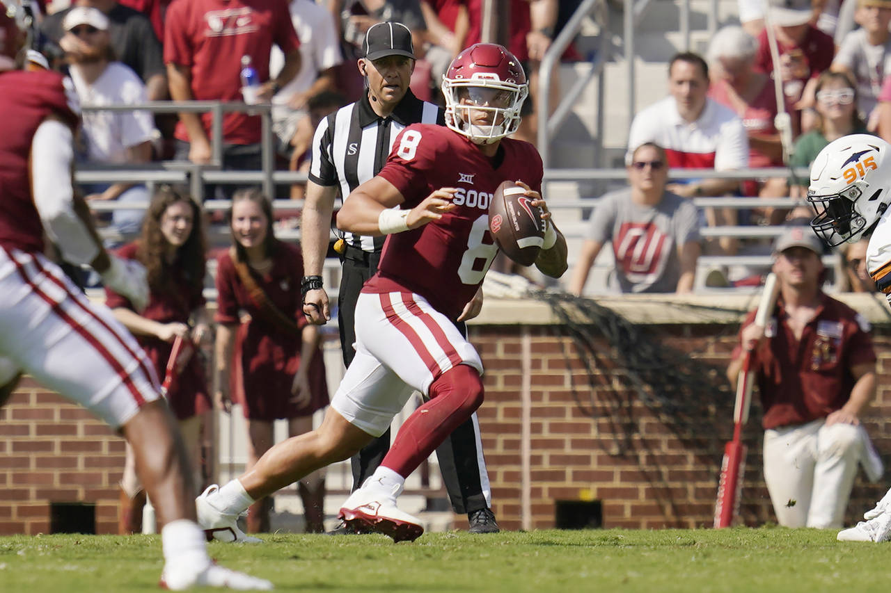 Oklahoma quarterback Dillon Gabriel (8) scrambles in the first half of an NCAA college football gam...