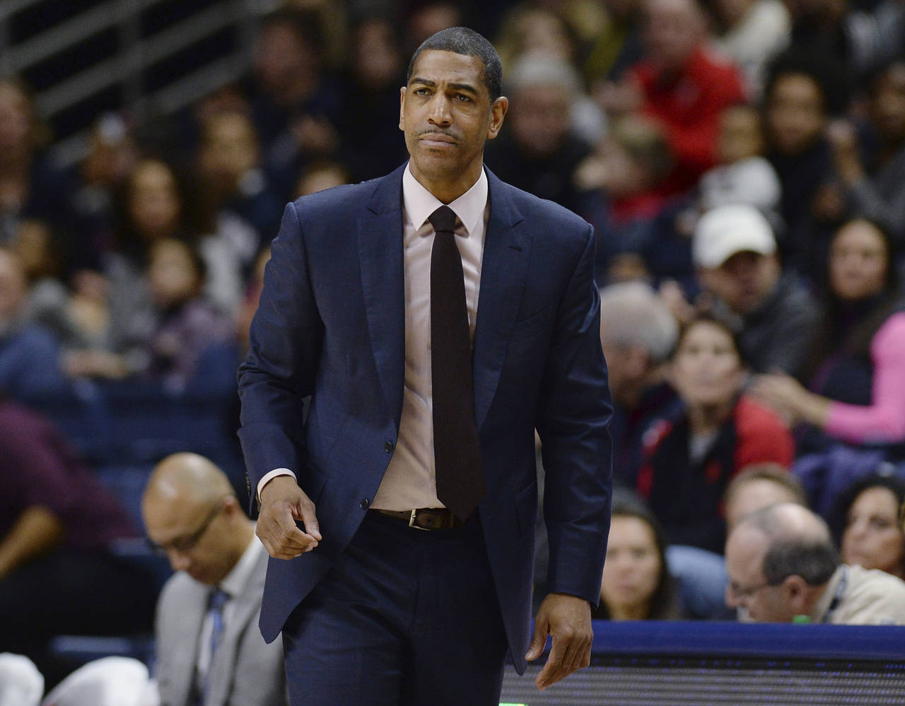 FILE - Then-Connecticut coach Kevin Ollie watches during the first half of an NCAA college basketba...