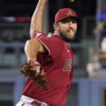 
              Arizona Diamondbacks starting pitcher Madison Bumgarner throws to the plate during the first inning of a baseball game against the Los Angeles Dodgers Wednesday, Sept. 21, 2022, in Los Angeles. (AP Photo/Mark J. Terrill)
            