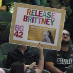 
              A fan at a WNBA playoff basketball game between the Seattle Storm and the Washington Mystics holds up a sign supporting Phoenix Mercury center Brittney Griner, Sunday, Aug. 21, 2022 in Seattle. Griner is being held in Russia after receiving a nine-year prison sentence for drug possession after police said they found vape canisters containing cannabis oil in her luggage at Moscow's Sheremetyevo Airport earlier in the year. (AP Photo/Ted S. Warren)
            