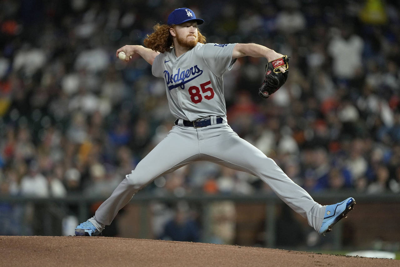 Los Angeles Dodgers pitcher Dustin May throws to a San Francisco Giants batter during the first inn...