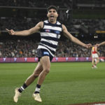 
              Tyson Stengle of Geelong celebrates kicking a goal during the AFL Preliminary Final match between the Geelong Cats and the Brisbane Lions at the Melbourne Cricket Ground in Melbourne, Friday, Sept. 16, 2022. Early Saturday morning, at a half past midnight, a small but passionate group of fans will gather in front of their TVs in America. They'll be watching the Grand Final, the Super Bowl of Aussie rules football. (AAP Image/Joel Carrett)
            