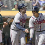 
              Atlanta Braves' Vaughn Grissom, right, celebrates as he crosses home plate with teammate Travis d'Arnaud, center, after hitting a two run home run against Oakland Athletics during the fifth inning of a baseball game in Oakland, Calif., Wednesday, Sept. 7, 2022. (AP Photo/Tony Avelar)
            