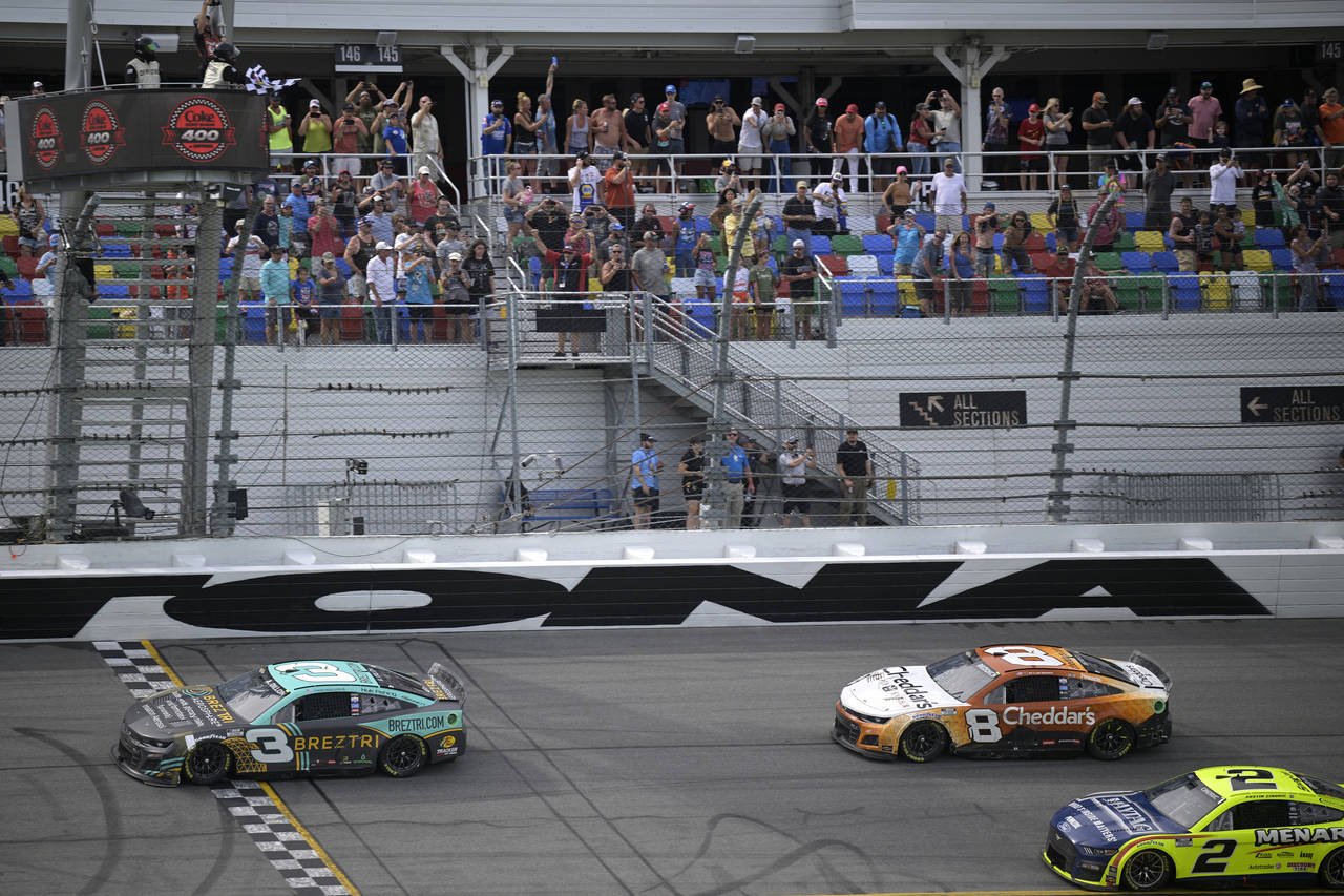 Austin Dillon (3) crosses the finish line in front of Tyler Reddick (8) and Austin Cindric (2) to w...