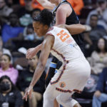 
              Connecticut Sun forward Alyssa Thomas keeps the ball from Chicago Sky forward Emma Meesseman during the first half of Game 4 in a WNBA basketball playoff semifinal Tuesday, Sept. 6, 2022, in Uncasville, Conn. (AP Photo/Jessica Hill)
            