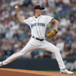 
              Seattle Mariners starting pitcher George Kirby works against the Atlanta Braves during the first inning of a baseball game, Saturday, Sept. 10, 2022, in Seattle. (AP Photo/John Froschauer)
            