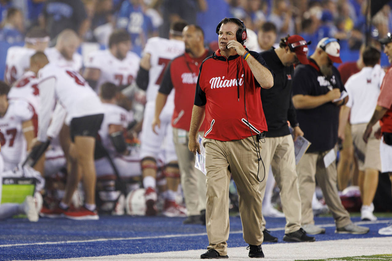 Miami (Ohio) head coach Chuck Martin walks down the sideline during the first half of an NCAA colle...