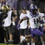 
              TCU wide receiver Derius Davis, right, runs for a touchdown after catching a pass with Colorado safety Tyrin Taylor in pursuit in the second half of an NCAA college football game Friday, Sept. 2, 2022, in Boulder, Colo. (AP Photo/David Zalubowski)
            